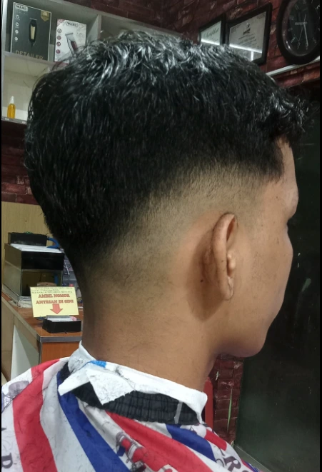 Man with styled pompadour hair