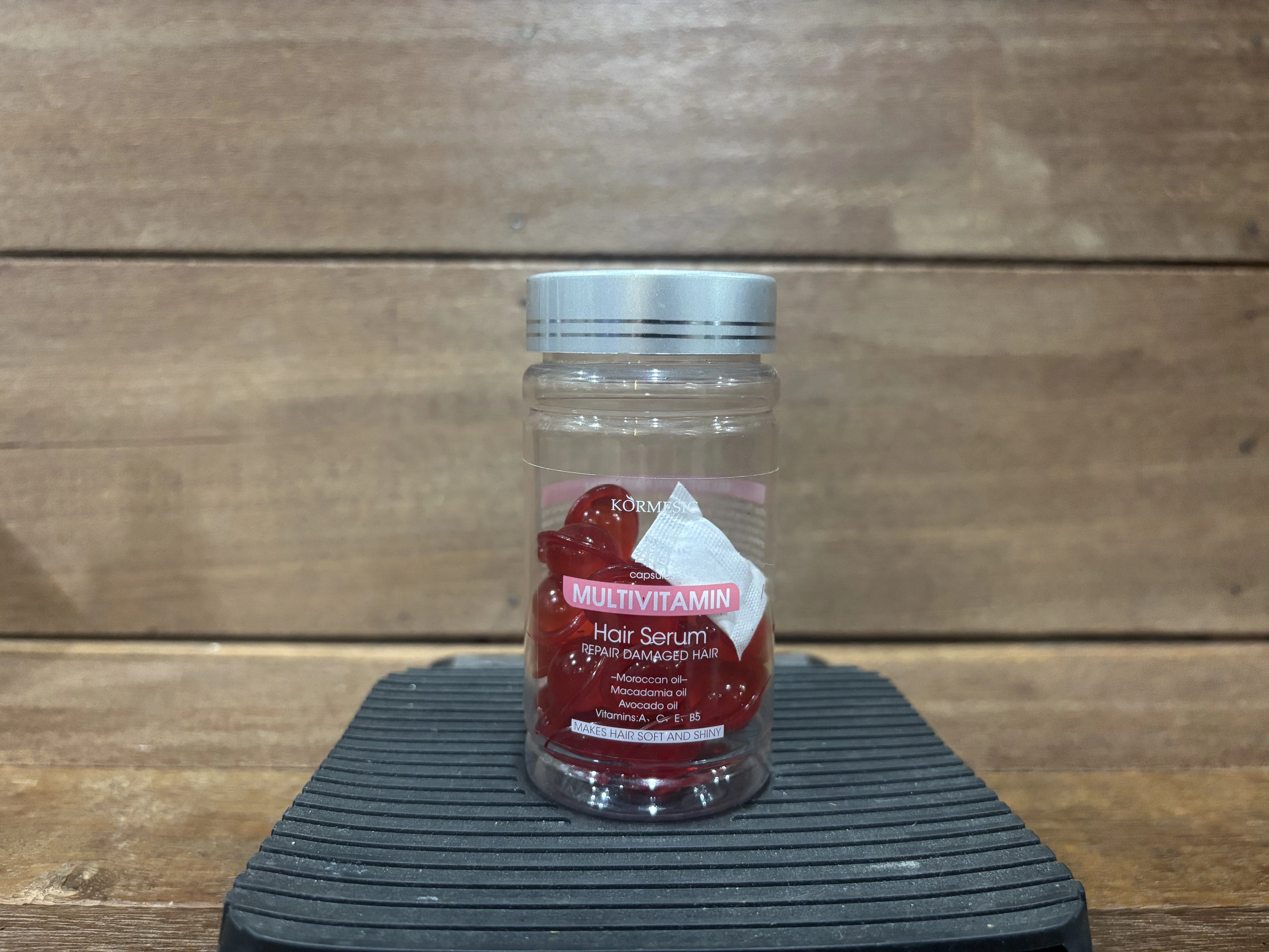 Colorful hair vitamin capsules in a jar